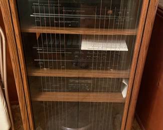 Stereo system with multiple components, speakers and turntable.