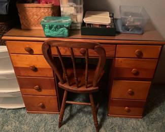 Solid wooden desk and chair.