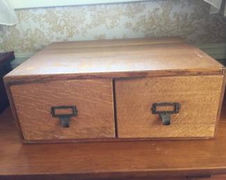 A two-drawer file is ideal to hold post cards or just about any smaller object. 