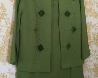 A vintage suit offers a stylish look for professional or more casual settings. Also found were a couple of scarves that would be great accent pieces for this beauty. 