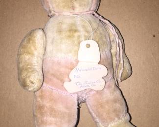 A plush pink toy from the 1940s by Mewaphil Dolls. 