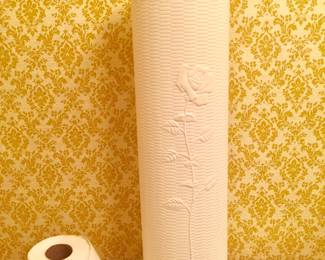 Yes, the toilet paper is supposed to be there. Well, actually it could be concealed in this blow mold TP tower with lid. 