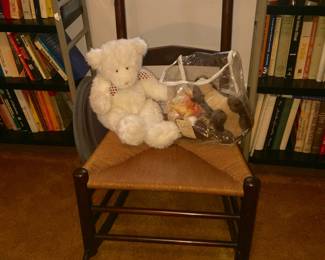 A generous woven seat makes this ideal for rocking a little one. The stuffed bear and small plush animals, shown in plastic tote, are good for play or display. 