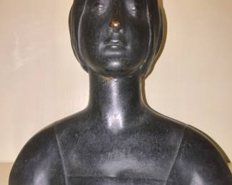 Metal bust of an unknown woman. 