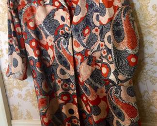 A silky coat with paisley design is ideal over casual or dress clothes. 