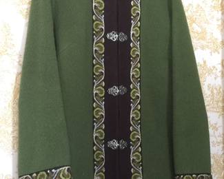 Stay warm and fashionable with this heavy wool jacket with beautiful trim and closures. 