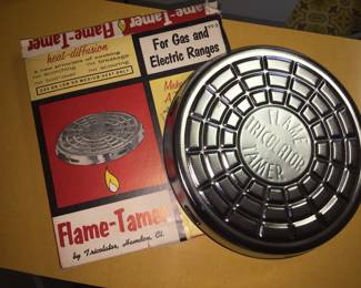 An interesting Flame-Tamer designed to diffuse heat on a stove. It appears to have never been used. 