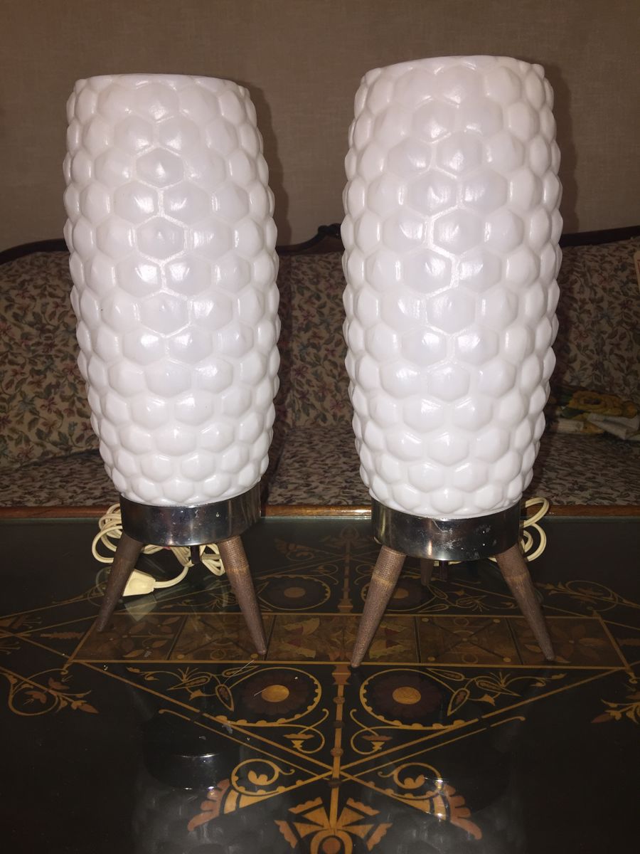 An unusual pair of Mid-Century Modern lamps. The plastic column shades and wood and metal base are in great vintage condition.