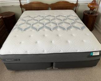 This king-sized bedframe is available, along with the mattress and box springs.