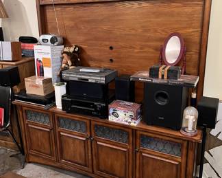 While there are 5.1 surround/stereo components sitting on top of the cabinet, don't forget to look at the cabinet itself.