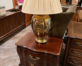 Here we have an ornate lamp and the side table on which it sits.