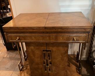 This side table has a similar style to other pieces in the dining room.