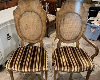 These are a pair of the matching dining chairs.  Well, one of them has arms, the other doesn't, but that is normal in dining chairs.