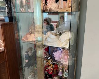 This is another look at the gold and glass display cabinet.  There are glass walls and shelves.  