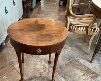 This table certainly looks as if it matches the dining table.  Who knows? Maybe it matches the dining table perfectly.