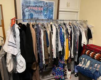 There are a good selection of clothing on a couple of racks.