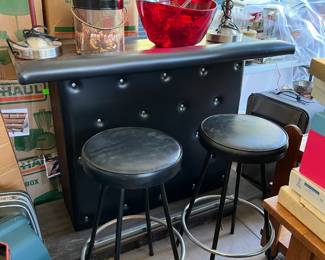 A small bar and bar stools is here.  You don't see these terribly often.