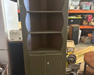 Green corner cabinet. Needs a knob 