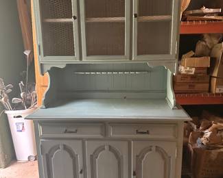 Color looks like duck egg. Refinished china cabinet with chicken wire door fronts 
