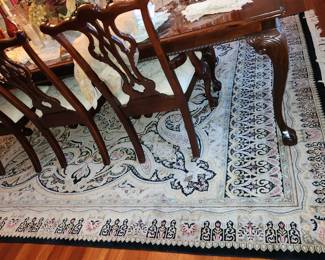large area rug (table and chairs will remain for staging)