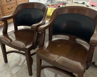 Pair of wood and leather office chairs with shaped seats
