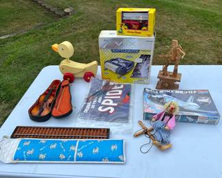 Toy Lot: Spider-Man, Curious George, NASA Space Shuttle, More
Battlebots, Toy Violin, Spider Man, Timberkits Mechanical Wooden Guitarist, Wooden Clown Marionette and more.