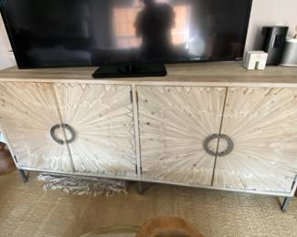 This sunburst douglas fur sideboard is available for pre-sale at $2,995.00 - firm