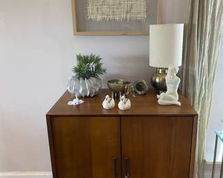 West Elm Mid-Century design bar cabinet available for pre-sale at $595.00.  See next frame for retail reference (estatesale.net removed my price reference photo)
