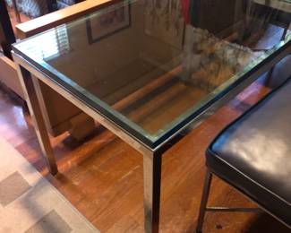 one of a pair of glass and chrome tables