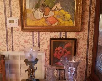 In rear is a tall Waterford vase.