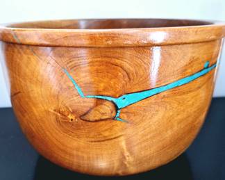 Handmade, native wooden bowl with turquoise accents. 