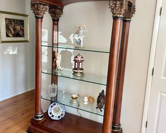 Ornate wood and glass shelving unit 