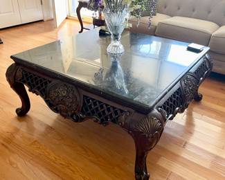 Square carved wood and glass coffee table 