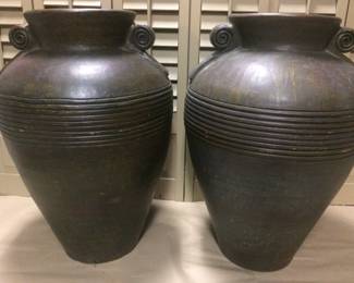 Ceramic large urns, dark brown with circular incising and vintage markings.  Purchased at estate sale in Oak Park.