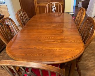 Kincaid table with one additional insert not pictured and eight chairs total