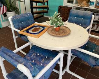 Pipe creations patio table and four chairs