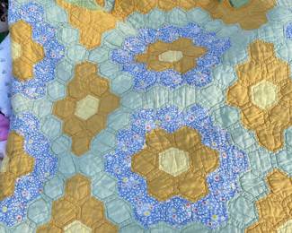 Vintage hand-sewn hexagon quilt. Unique setting for a hexagon quilt and in great condition.