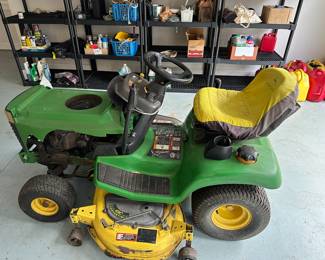 G91 - $600. John Deere riding lawn mower LX277- starts right up! No hood. 48" deck. 