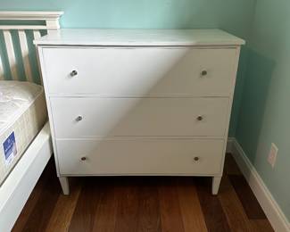 G46 - $25. White dresser - front leg is cracked - drawers all slide. Top has some wear. 