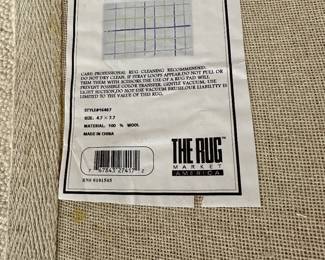 G49 - $100. Wool Rug measures 90"x 55" 