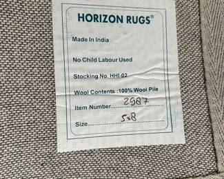 G51 - $100 - Measures 8' x 5'. 100% wool. Horizon rug brand. 
