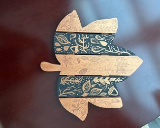 G60 - $6 painted leaf wall hanging. 