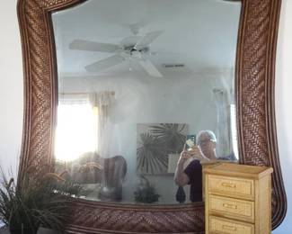 Rattan mirror matches dresser