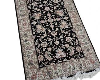 Area rug with black tones