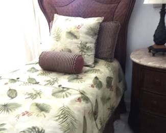 One of a pair of Rattan twin beds with custom bedding