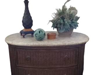 Oval rattan nightstand with marble top
