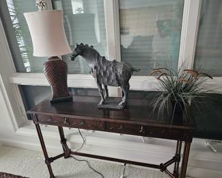 Traditional console table with decorative items