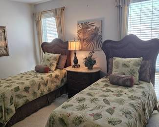 Pair of Rattan twin beds with custom bedding and pillows