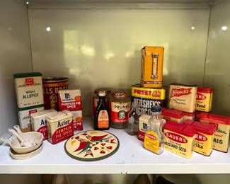 assorted vintage metal spice tins