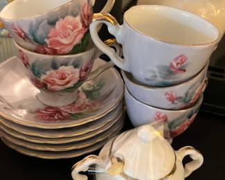 Rose pattern cups/saucers